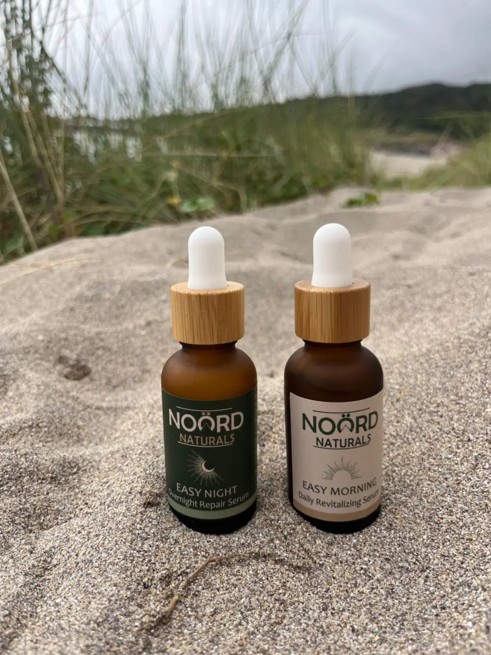 Noord Easy Morning and Easy Night serums in the sand